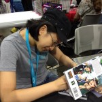 I bought a copy of Polterguys from Laur Uy. Haven't finished the comic yet, but, so far, I love it. Here she is signing the copy.