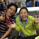 Ejen Chuang, the guy behind Cosplay in America, with his booth neighbor, talented artist Kay.